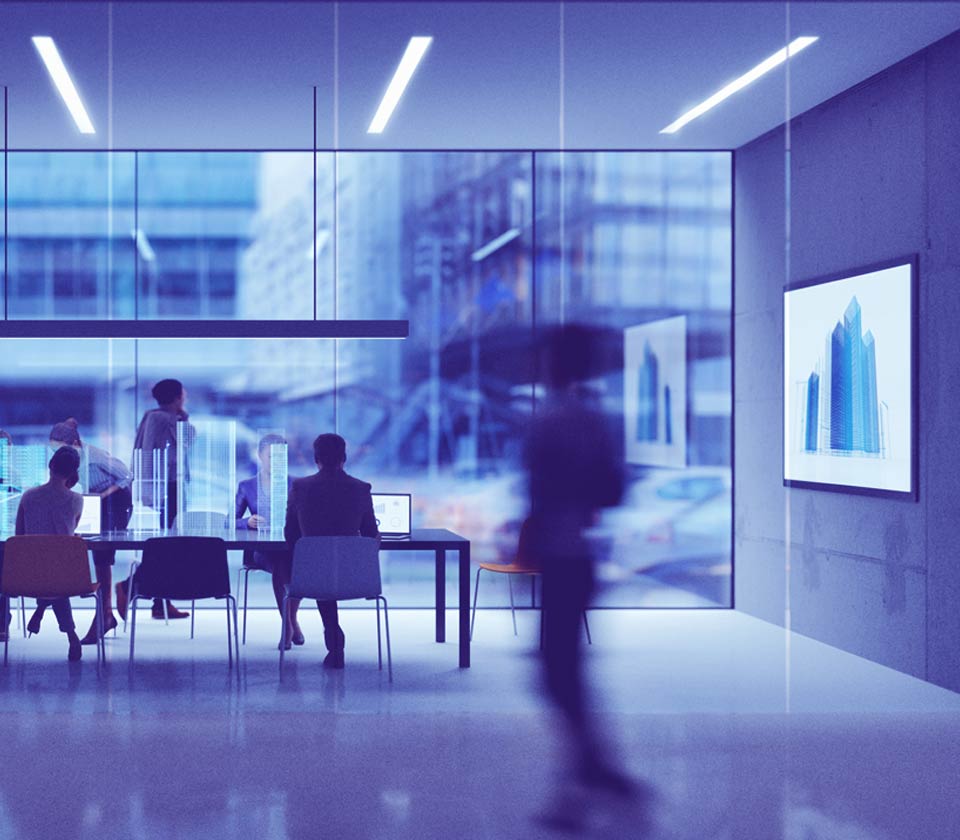 Imagem de um escritório com pessoas trabalhando em uma mesa, alguns efeitos de tecnologia dão um ar de futurismo.